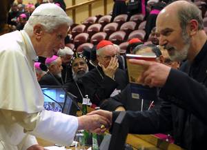 Photo: The Pope receives books on the topic of the persecution of Christians Â© LâOsservatore Romano