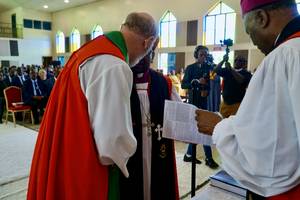 Photo: Directly after the actual hand laying: Yassir Eric and Thomas Paul Schirrmacher, on the right the main consecrator, the Anglican Archbishop of Rwanda © BQ/Schirrmacher